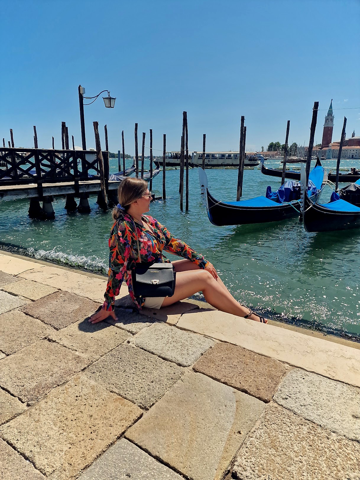 Resting by the water across from the gondolas in Venice