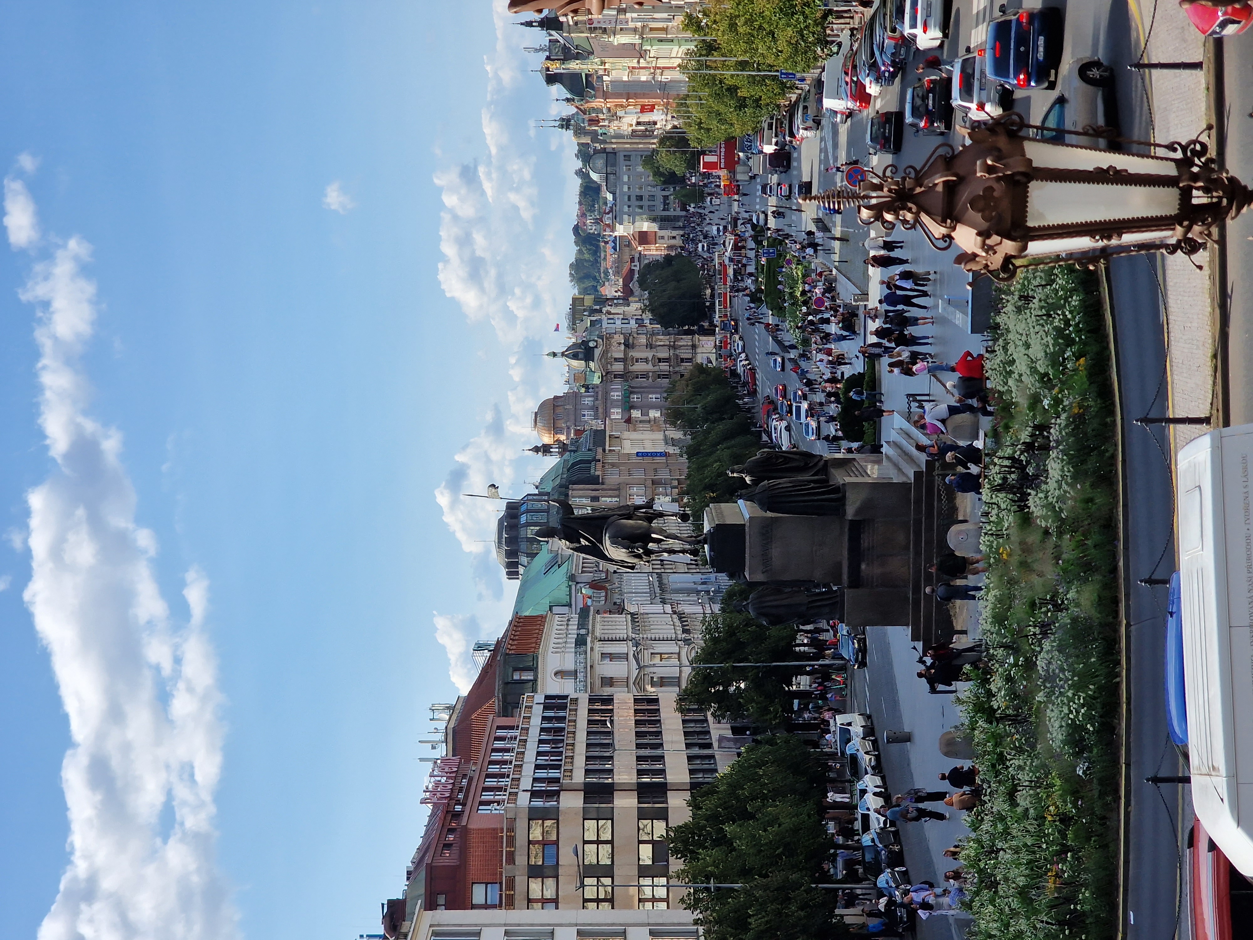 Long boulevard of Wenceslas Square in Prague seen from above with the National Museum at the far end and the equestrian statue of King Wenceslas in the middle