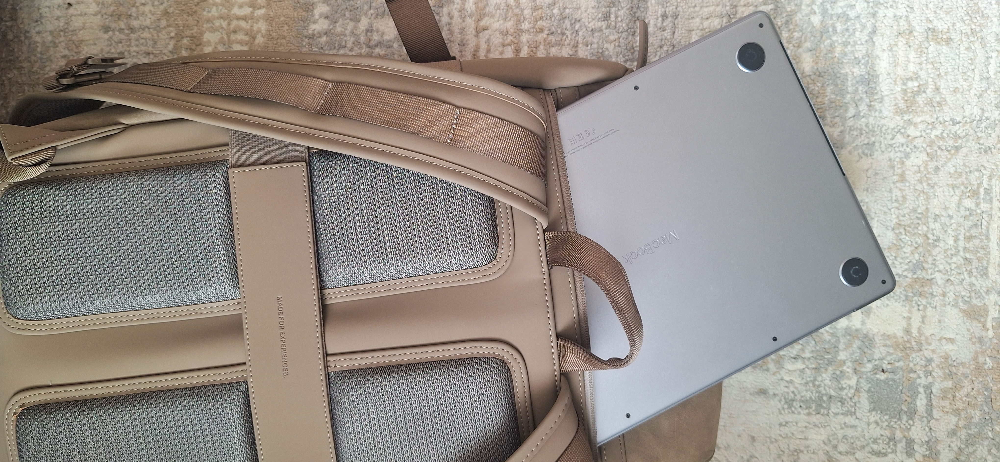 Padded mesh back panel of the Kapten & Son Bali Medium backpack with a MacBook sliding into the laptop compartment