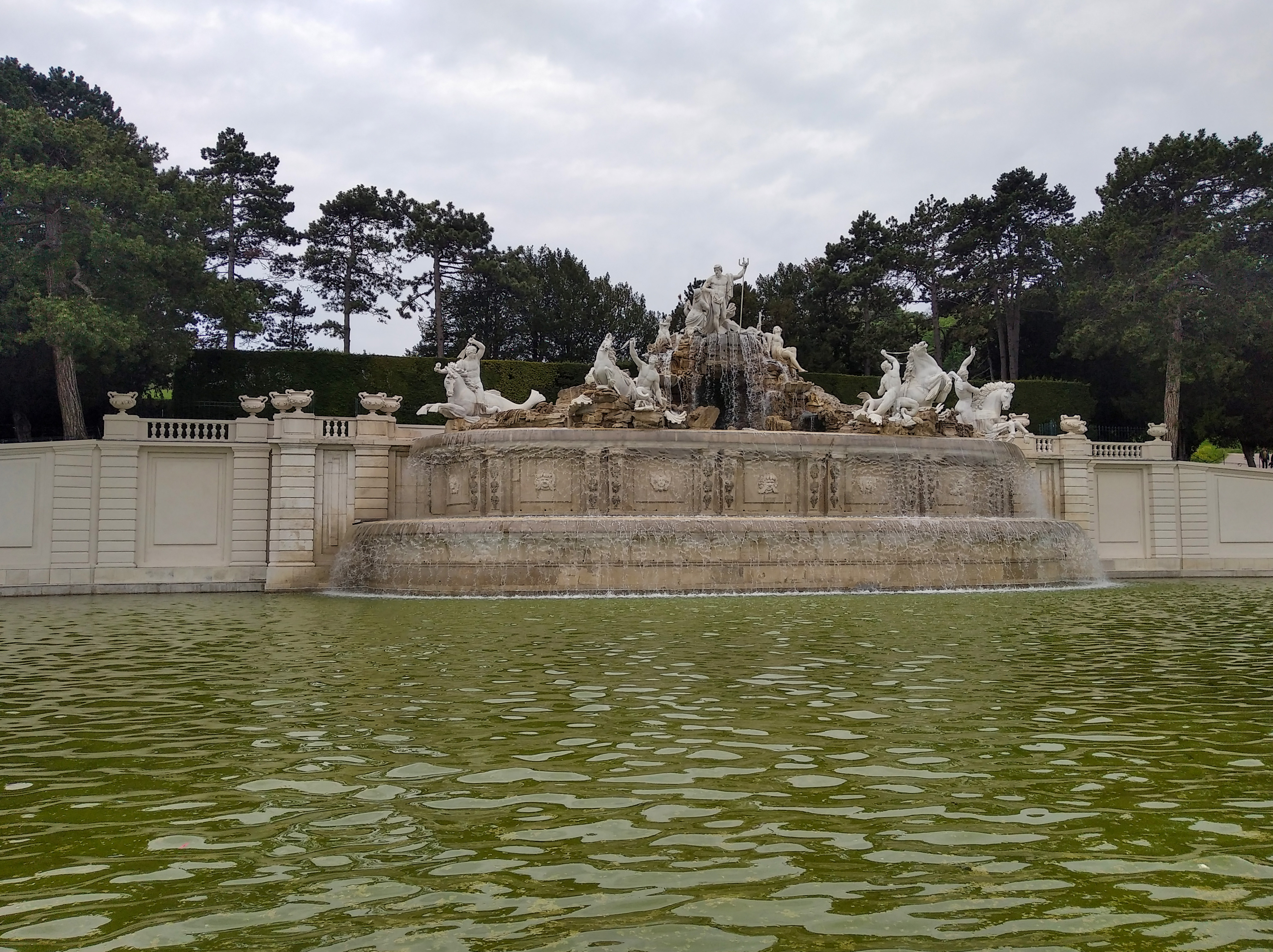 Neptune Fountain in the Schönbrunn gardens — a sculptural group of sea horses and Neptune in a basin