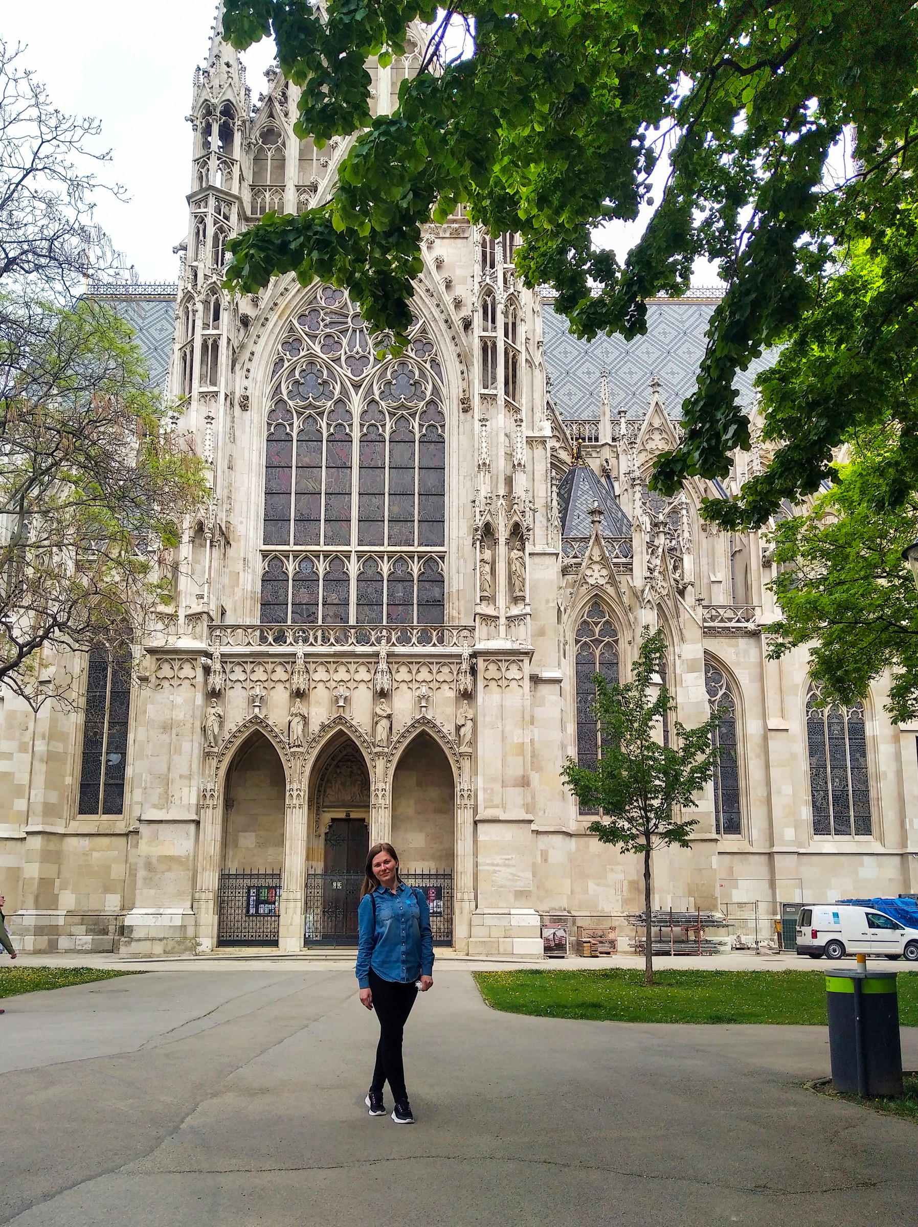 Votivkirche — the neo-gothic cathedral on Vienna's Ringstrasse, framed by young chestnut leaves in early May